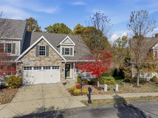 a aerial view of a house with a yard