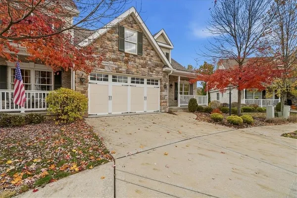 a front view of a house with a glass door