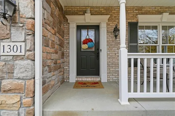 a view of a chairs and table in patio
