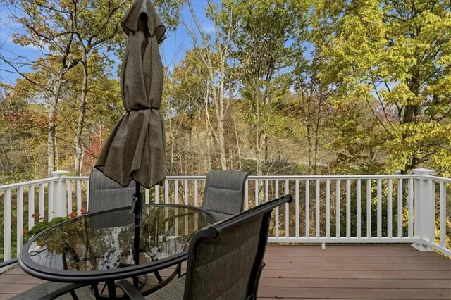 a balcony with trees in front of it