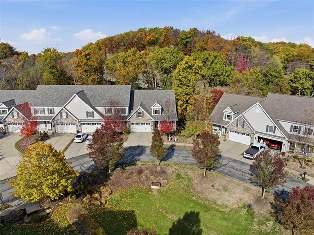 front view of a house with a fountain