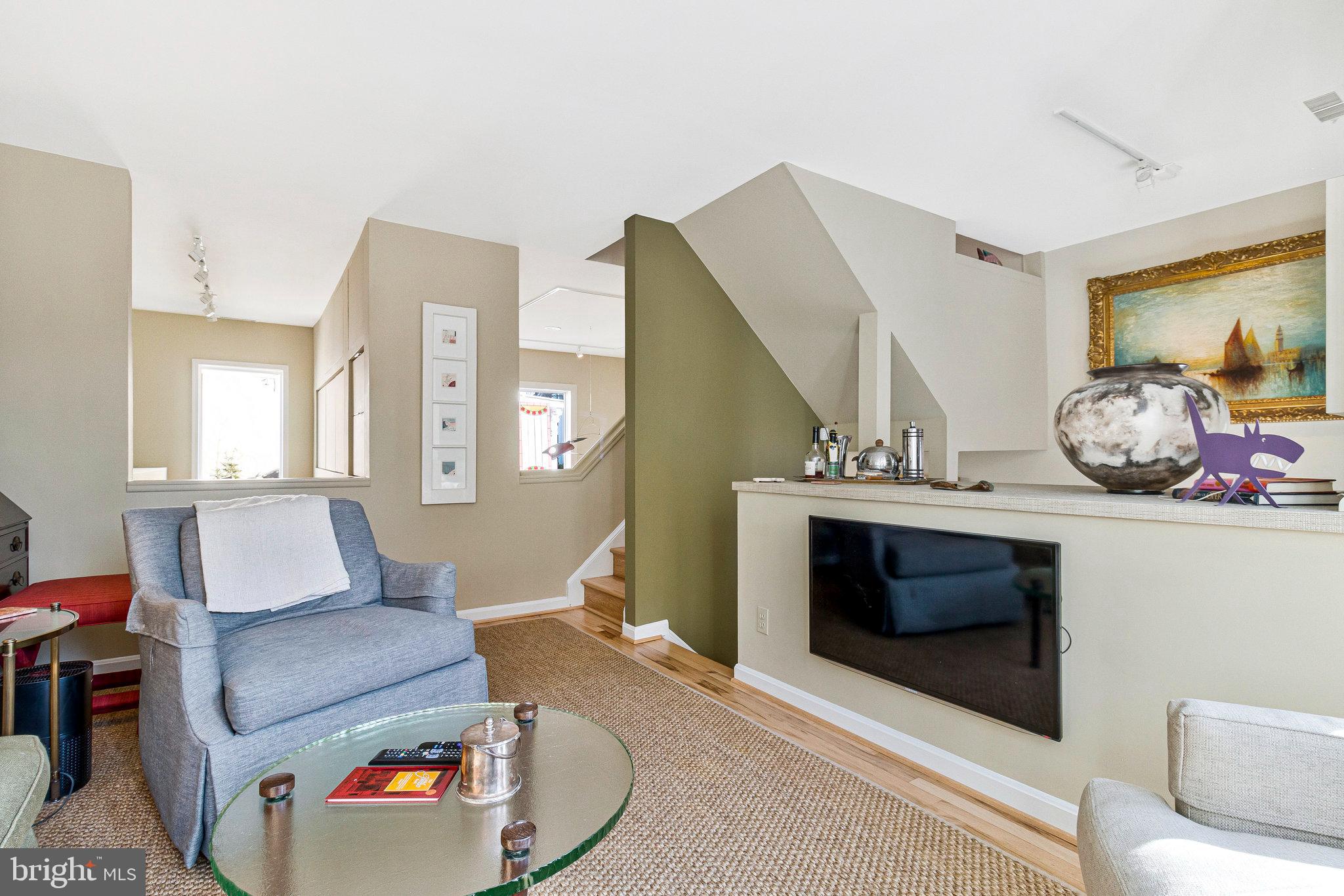 1501 Church Street Northwest Washington, DC 20005 - Photo 13 of 51 a living room with furniture and a fireplace
