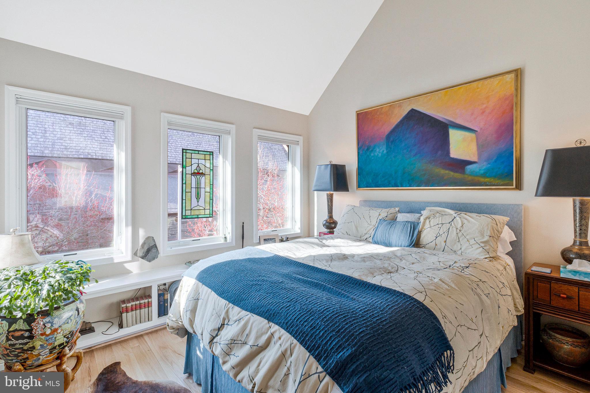 1501 Church Street Northwest Washington, DC 20005 - Photo 24 of 51 a bedroom with a bed and a painting on the wall