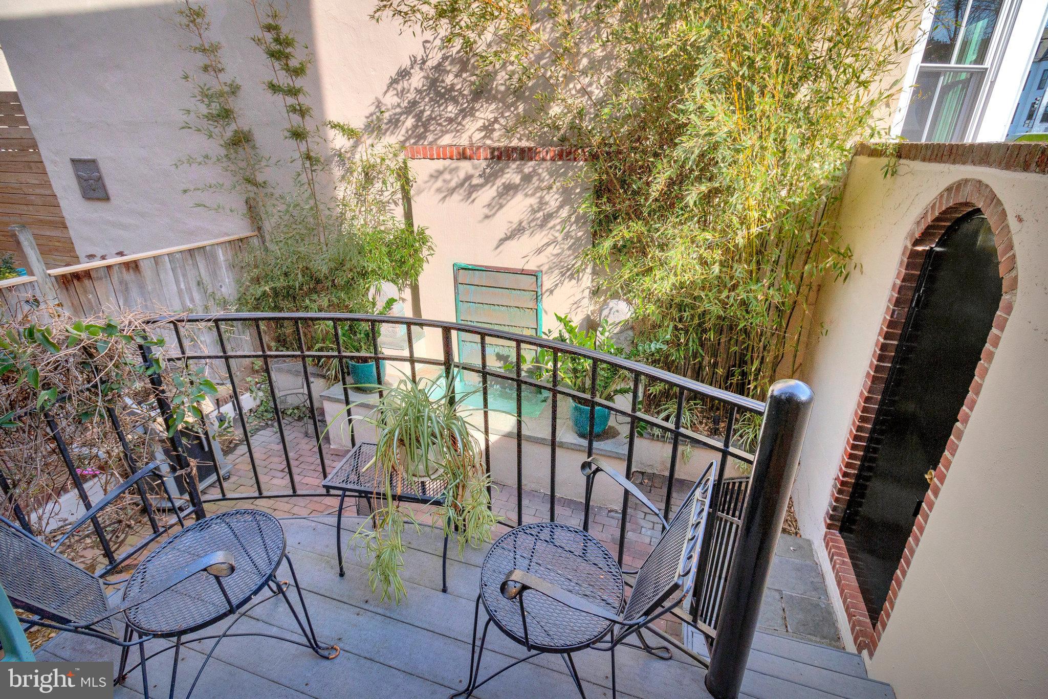 1501 Church Street Northwest Washington, DC 20005 - Photo 28 of 51 a view of balcony with wooden floor and outdoor seating