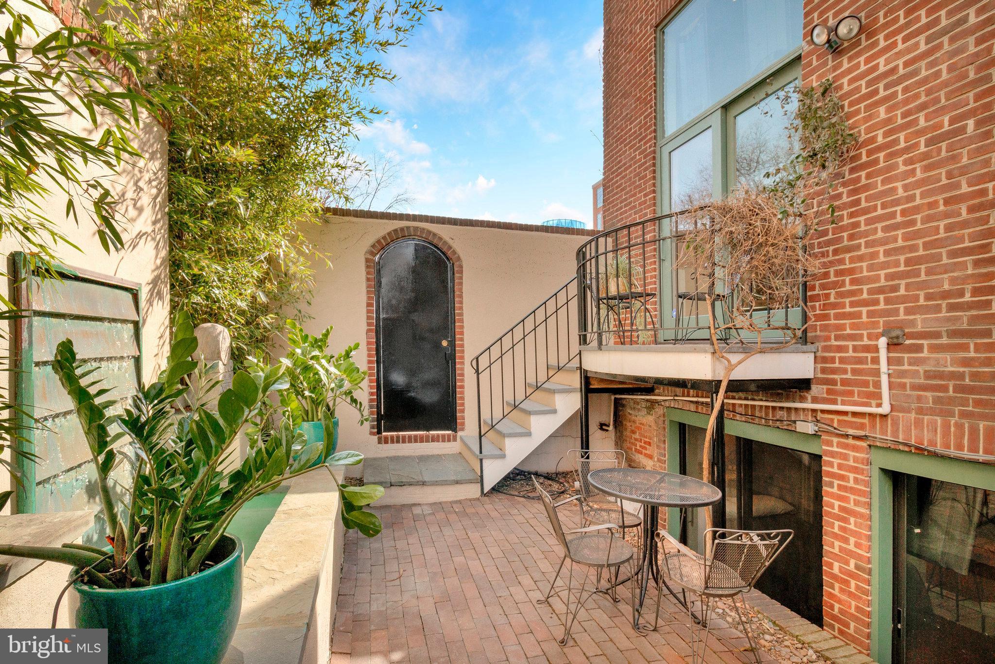 1501 Church Street Northwest Washington, DC 20005 - Photo 31 of 51 a view of balcony with wooden floor and potted plants