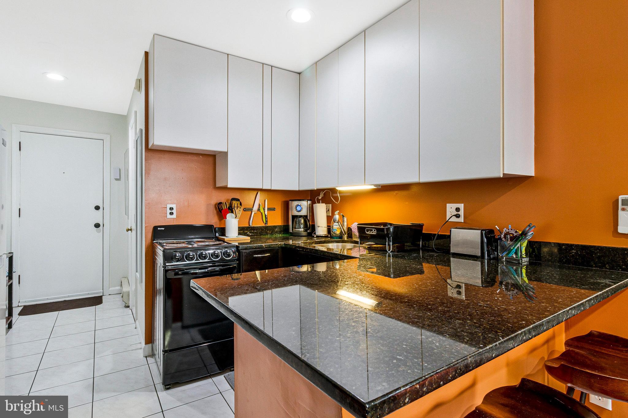 1501 Church Street Northwest Washington, DC 20005 - Photo 34 of 51 a kitchen with stainless steel appliances granite countertop a counter top and a stove