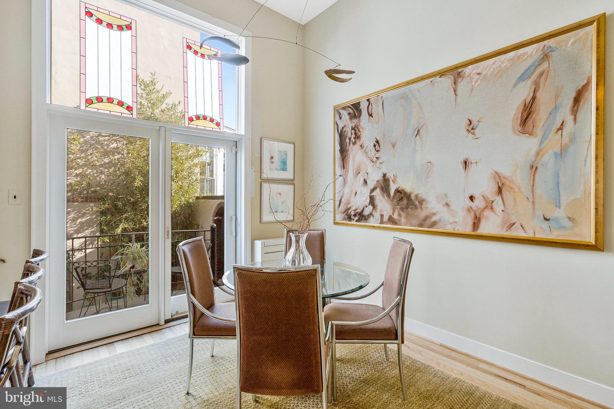 1501 Church Street Northwest Washington, DC 20005 - Photo 5 of 51 a dining room with wooden floor and a table chair