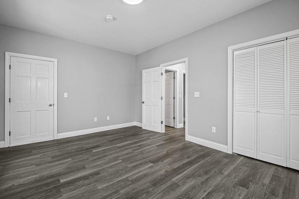 509 High Street Clinton, MA 01510 - Photo 12 of 42 a view of an empty room with wooden floor