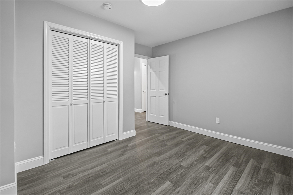 509 High Street Clinton, MA 01510 - Photo 16 of 42 a view of an empty room with wooden floor