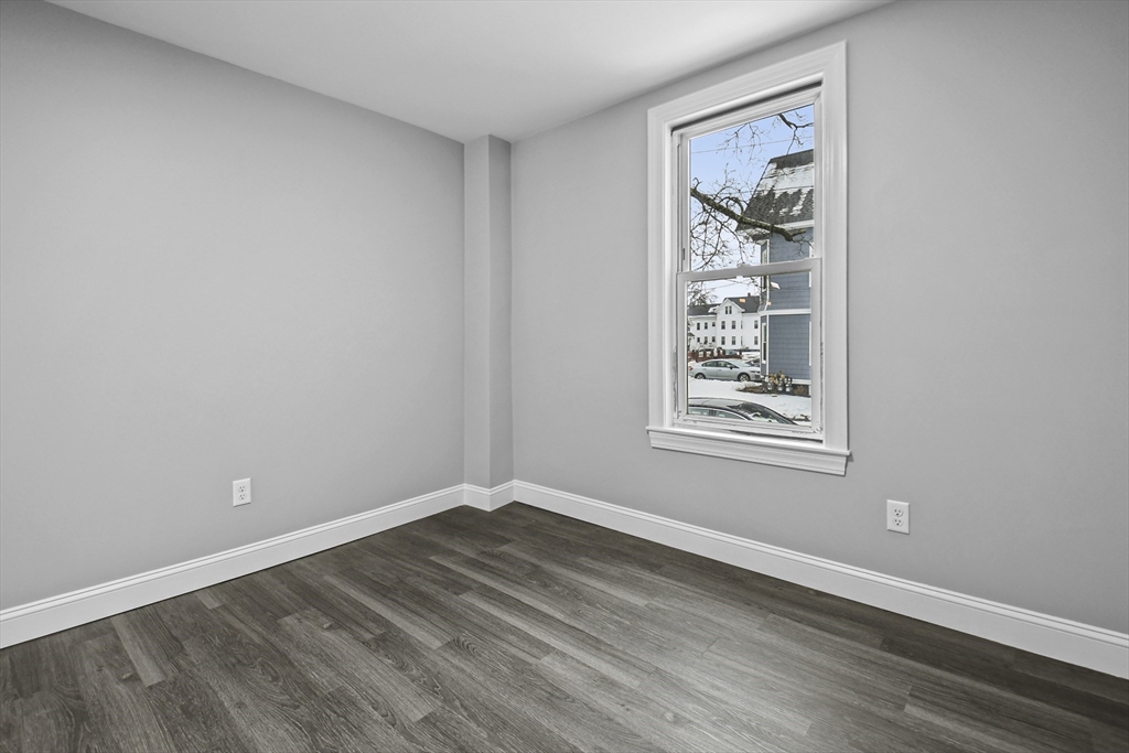 509 High Street Clinton, MA 01510 - Photo 17 of 42 a view of a small space with wooden floor and a window