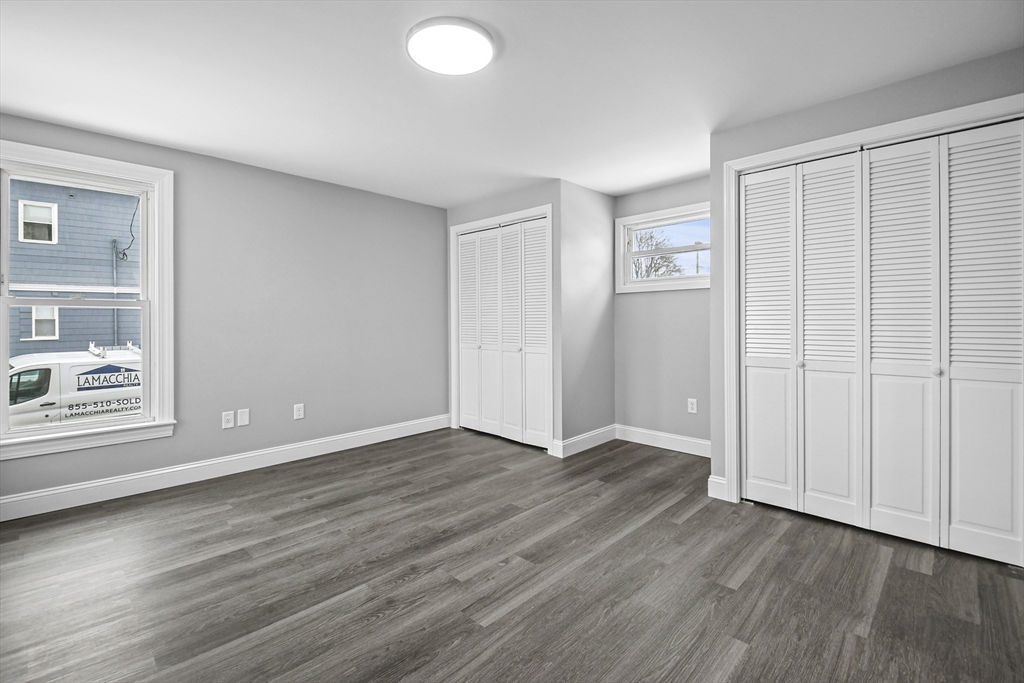 509 High Street Clinton, MA 01510 - Photo 18 of 42 a view of an empty room with wooden floor and a window