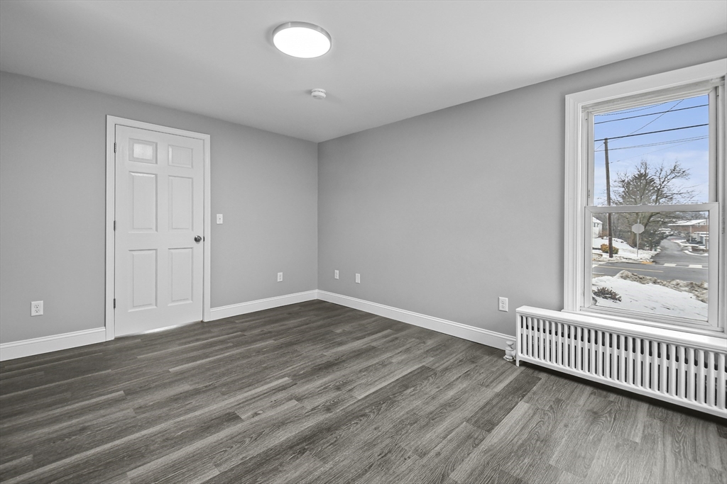 509 High Street Clinton, MA 01510 - Photo 20 of 42 a view of a room with wooden floor and a window