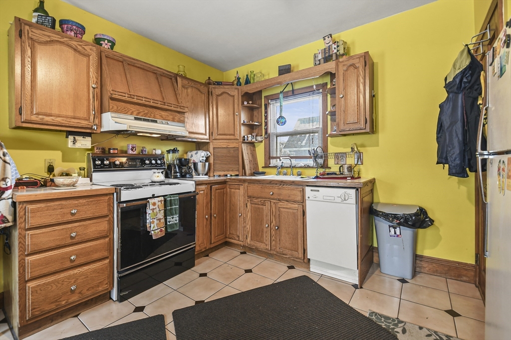 509 High Street Clinton, MA 01510 - Photo 26 of 42 a utility room with cabinets dryer and washer