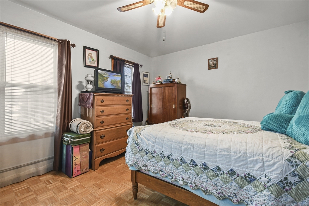 509 High Street Clinton, MA 01510 - Photo 29 of 42 a bedroom with a bed and dresser with mirror
