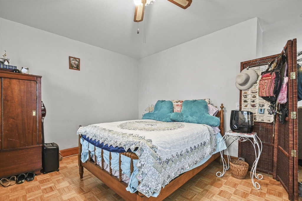509 High Street Clinton, MA 01510 - Photo 30 of 42 a bedroom with a bed a couch and dresser