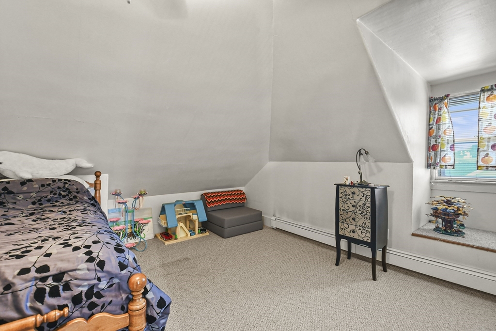 509 High Street Clinton, MA 01510 - Photo 36 of 42 a bedroom with bed and a window