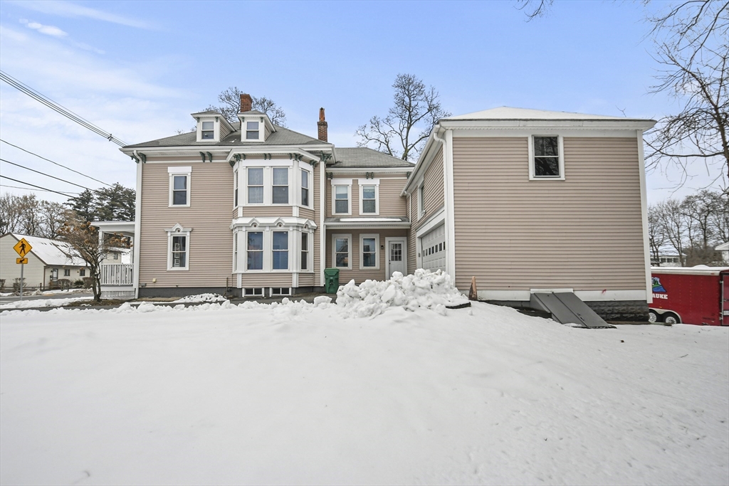 509 High Street Clinton, MA 01510 - Photo 42 of 42 front view of a house with a snow on the road