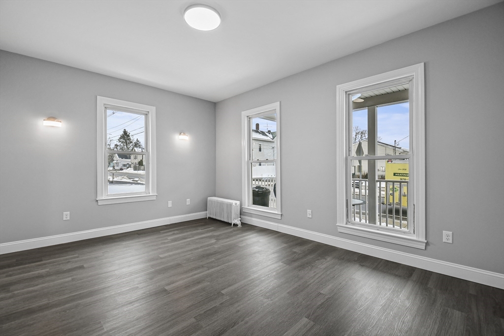 509 High Street Clinton, MA 01510 - Photo 10 of 42 a view of livingroom with hardwood floor and window