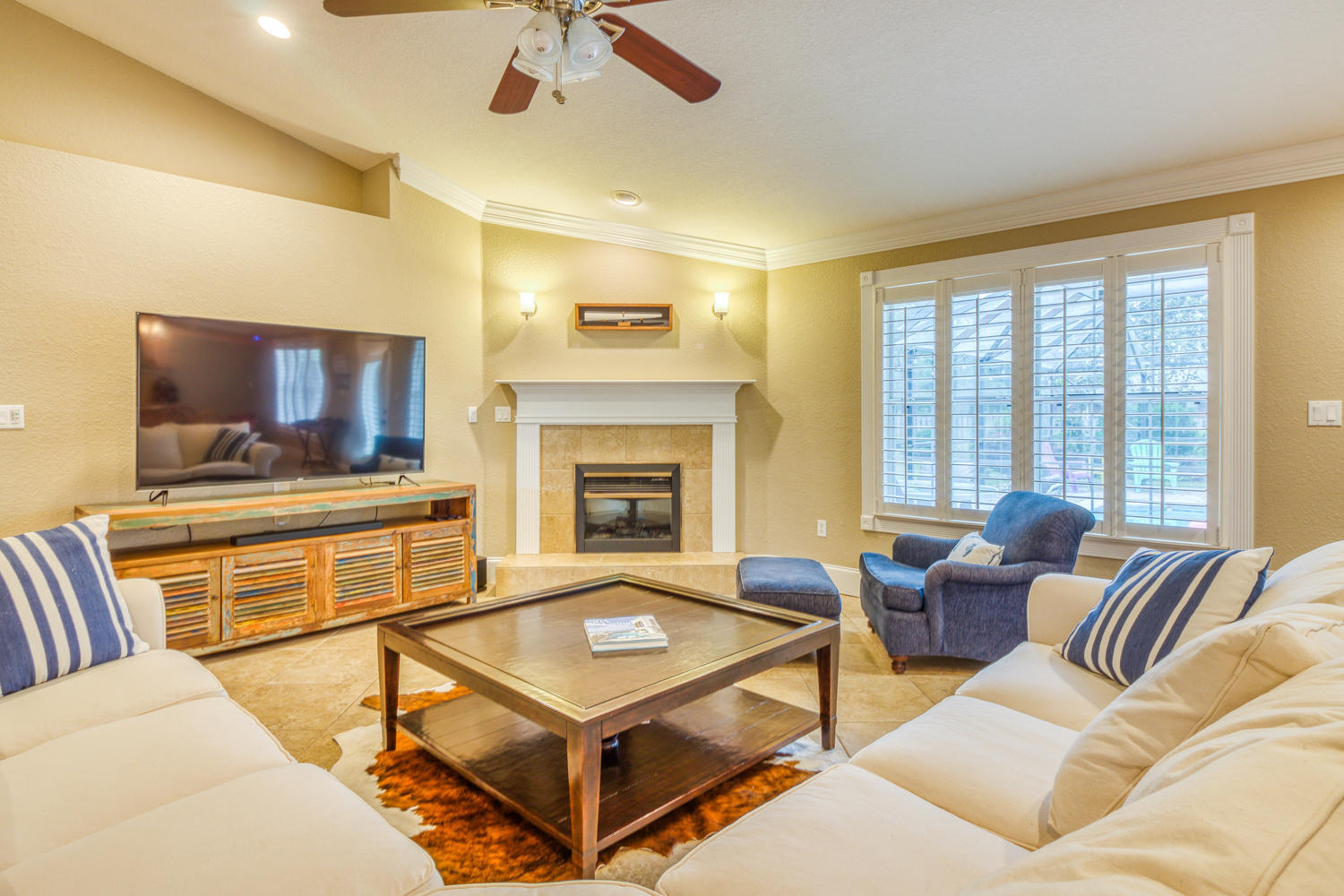 17 Buck Road Santa Rosa Beach, FL 32459 - Photo 8 of 41 a living room with furniture and a flat screen tv
