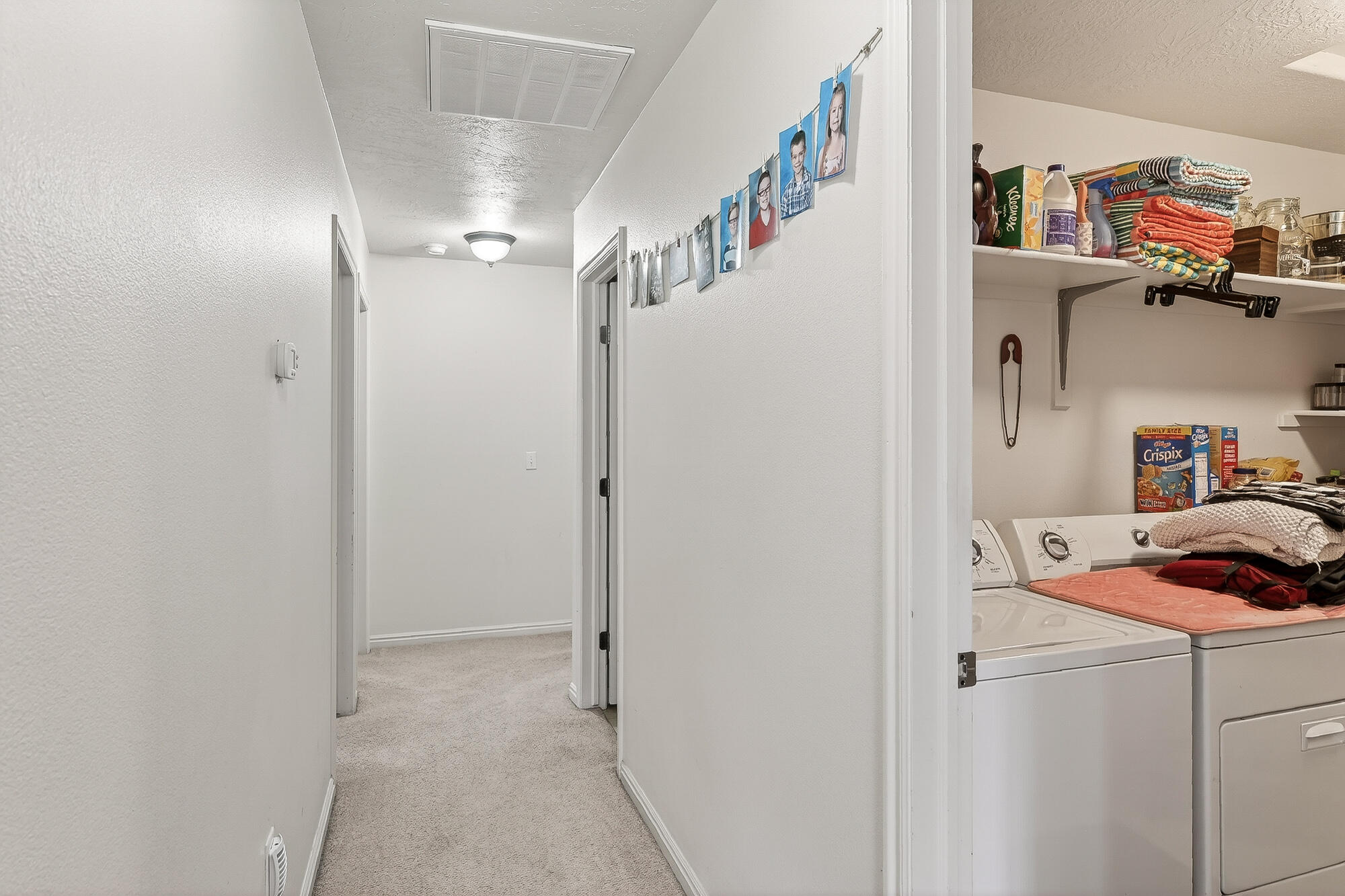 577-593 East Nichols Canyon Road, Unit 577579 & 591593 RV GARAGE Cedar City, UT 84721 - Photo 17 of 102 A hallway just beyond the kitchen leads to the bedrooms and bathrooms.