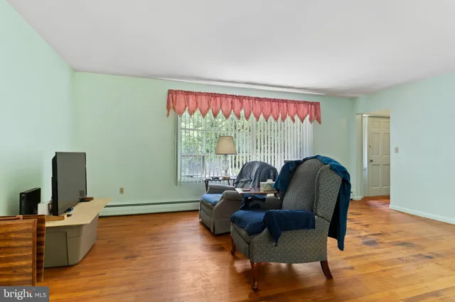 a view of an empty room and a window