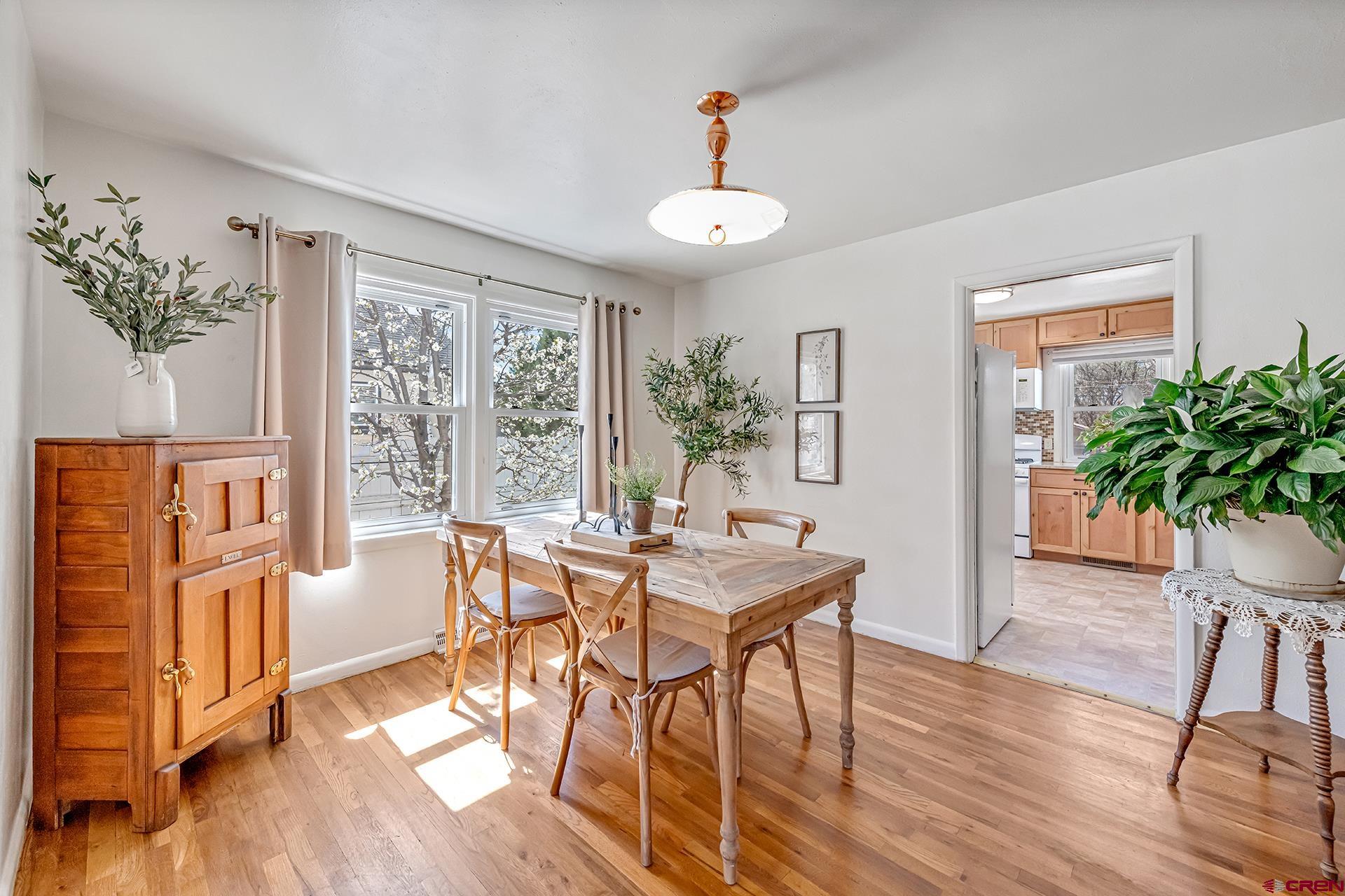 735 Howard Street Delta, CO 81416 - Photo 11 of 34 a view of a dining room with furniture window and wooden floor