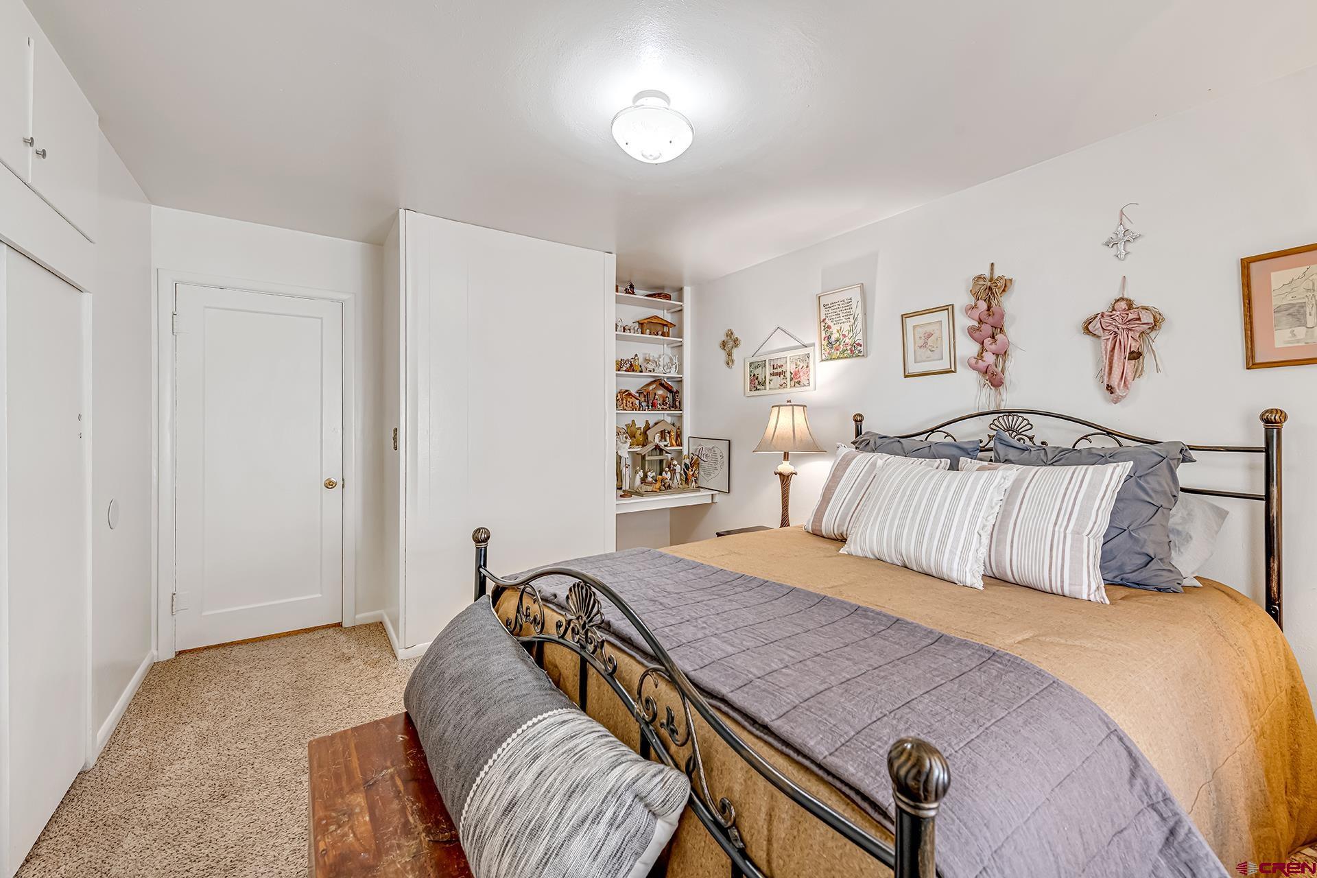 735 Howard Street Delta, CO 81416 - Photo 18 of 34 a bedroom with a bed and closet