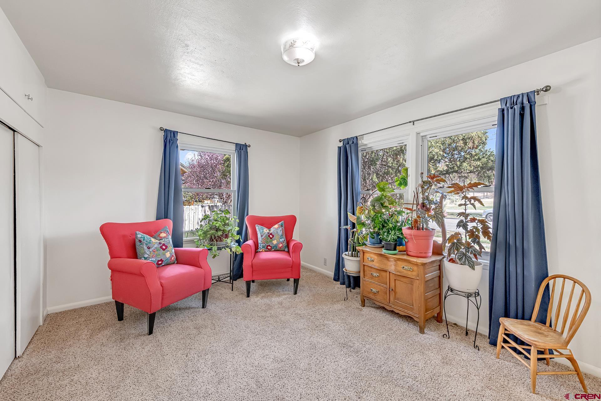 735 Howard Street Delta, CO 81416 - Photo 21 of 34 a living room with furniture and a large window