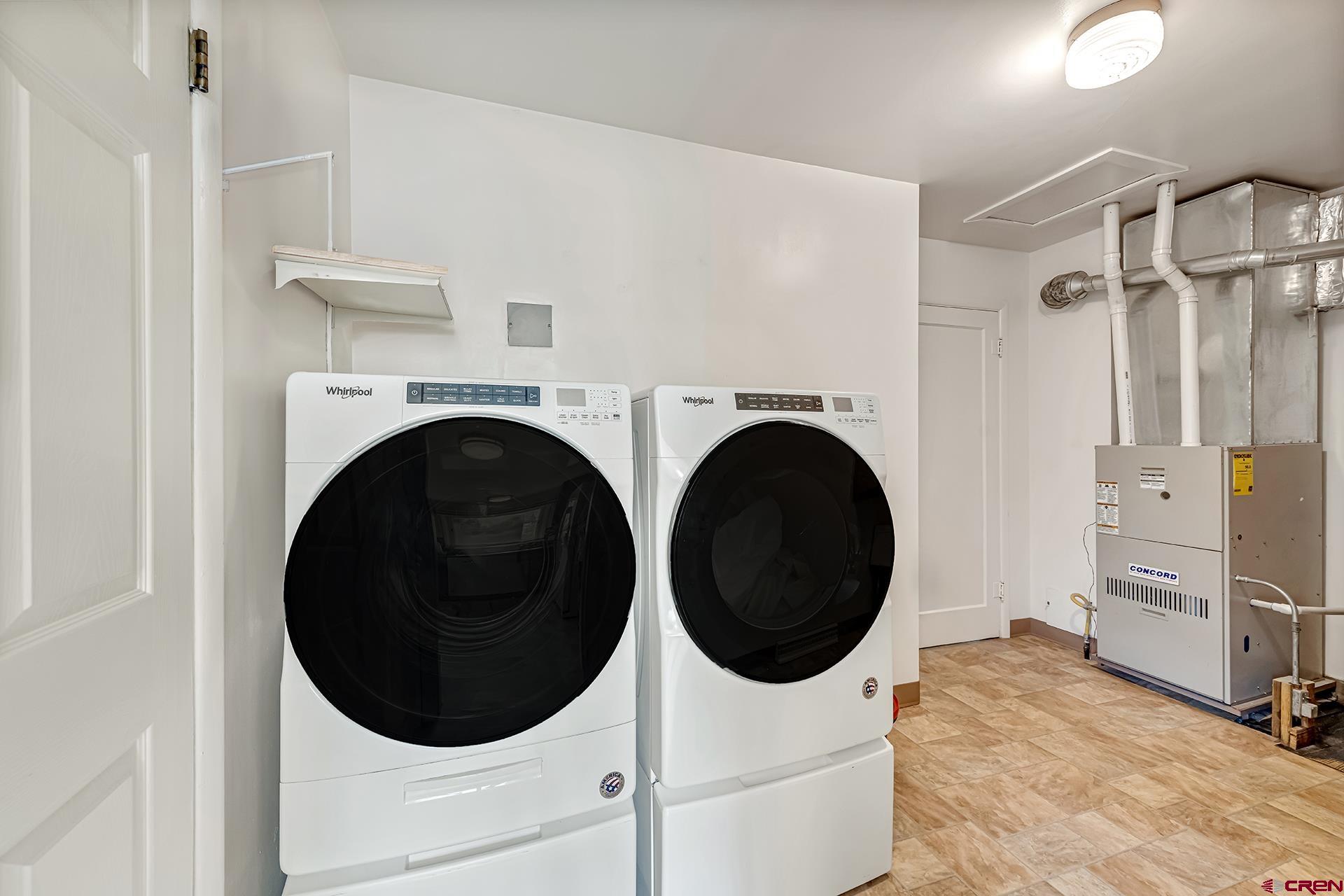 735 Howard Street Delta, CO 81416 - Photo 28 of 34 a living room with furniture and a washing machine