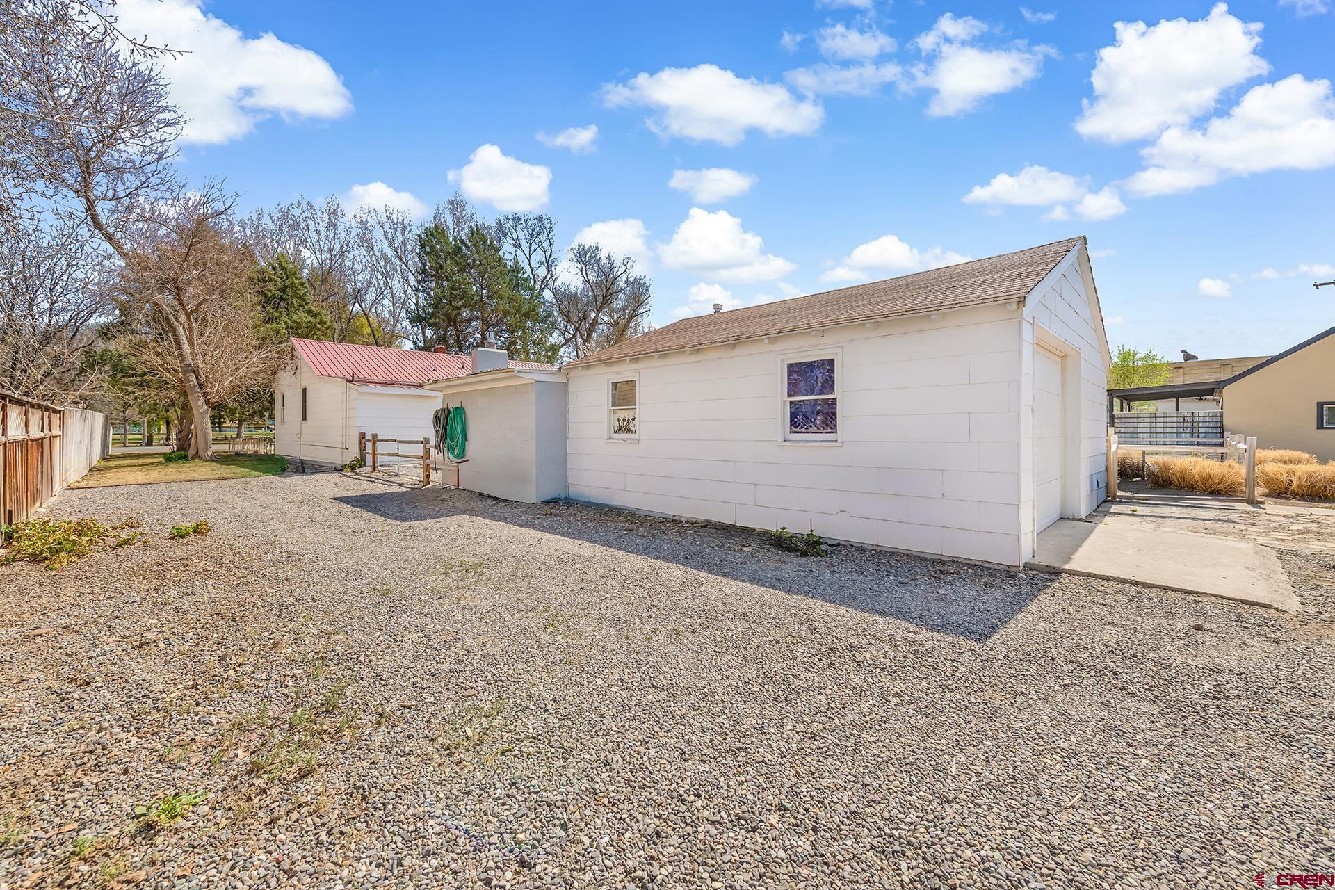 735 Howard Street Delta, CO 81416 - Photo 32 of 34 a view of a house with a backyard