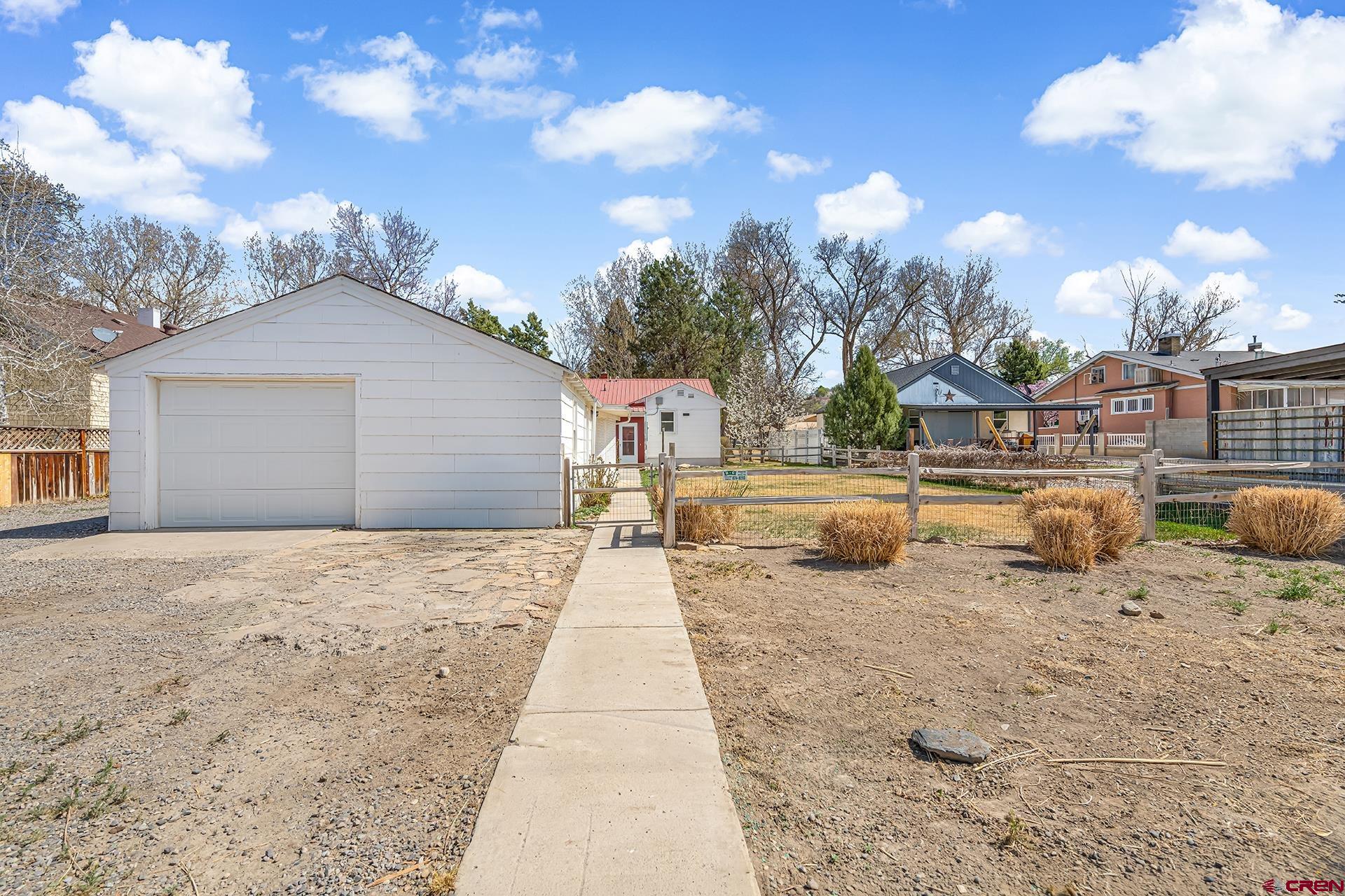 735 Howard Street Delta, CO 81416 - Photo 33 of 34 a row of houses with outdoor space