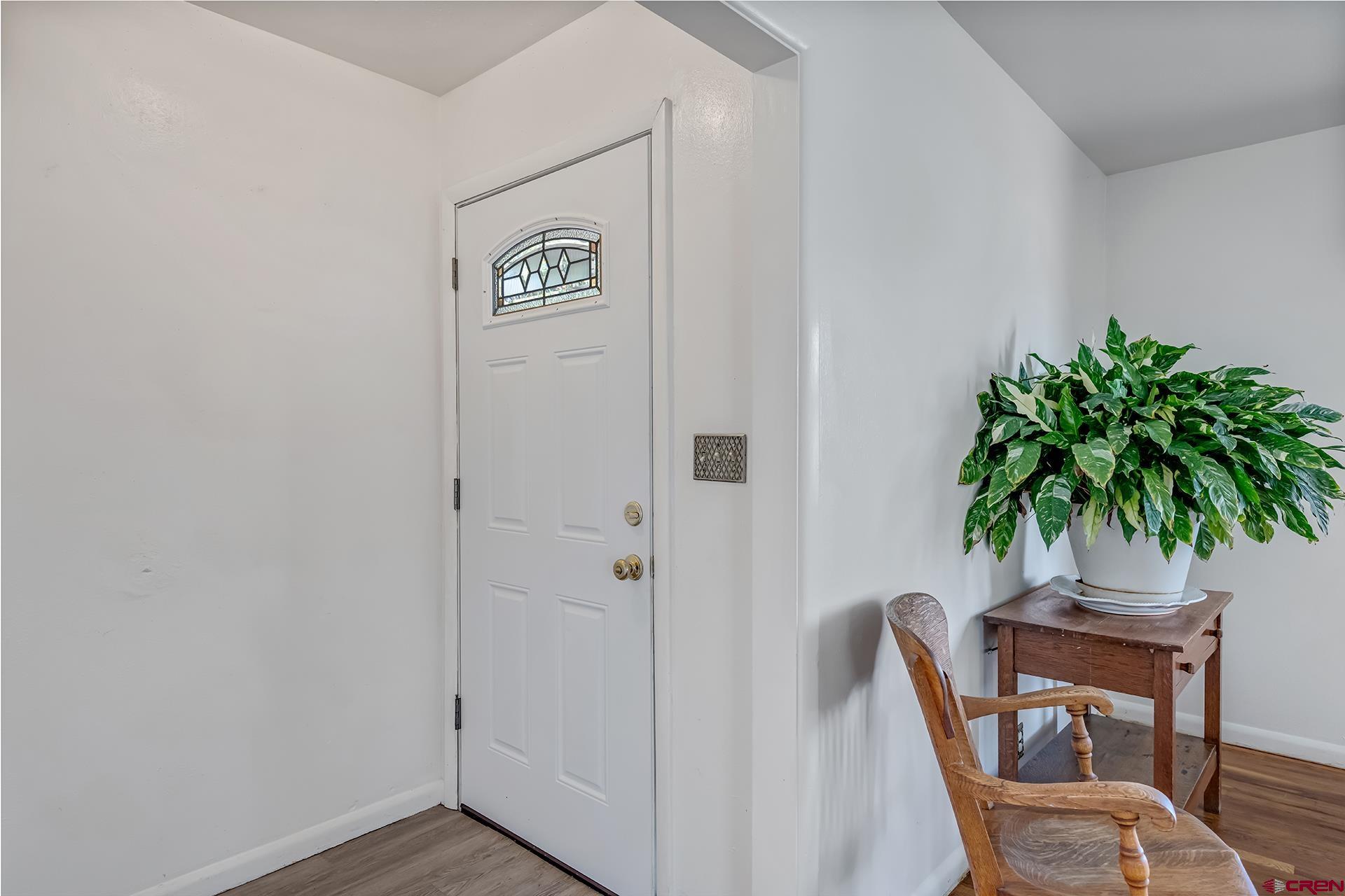 735 Howard Street Delta, CO 81416 - Photo 6 of 34 a view of a room with a potted plant and wooden floor