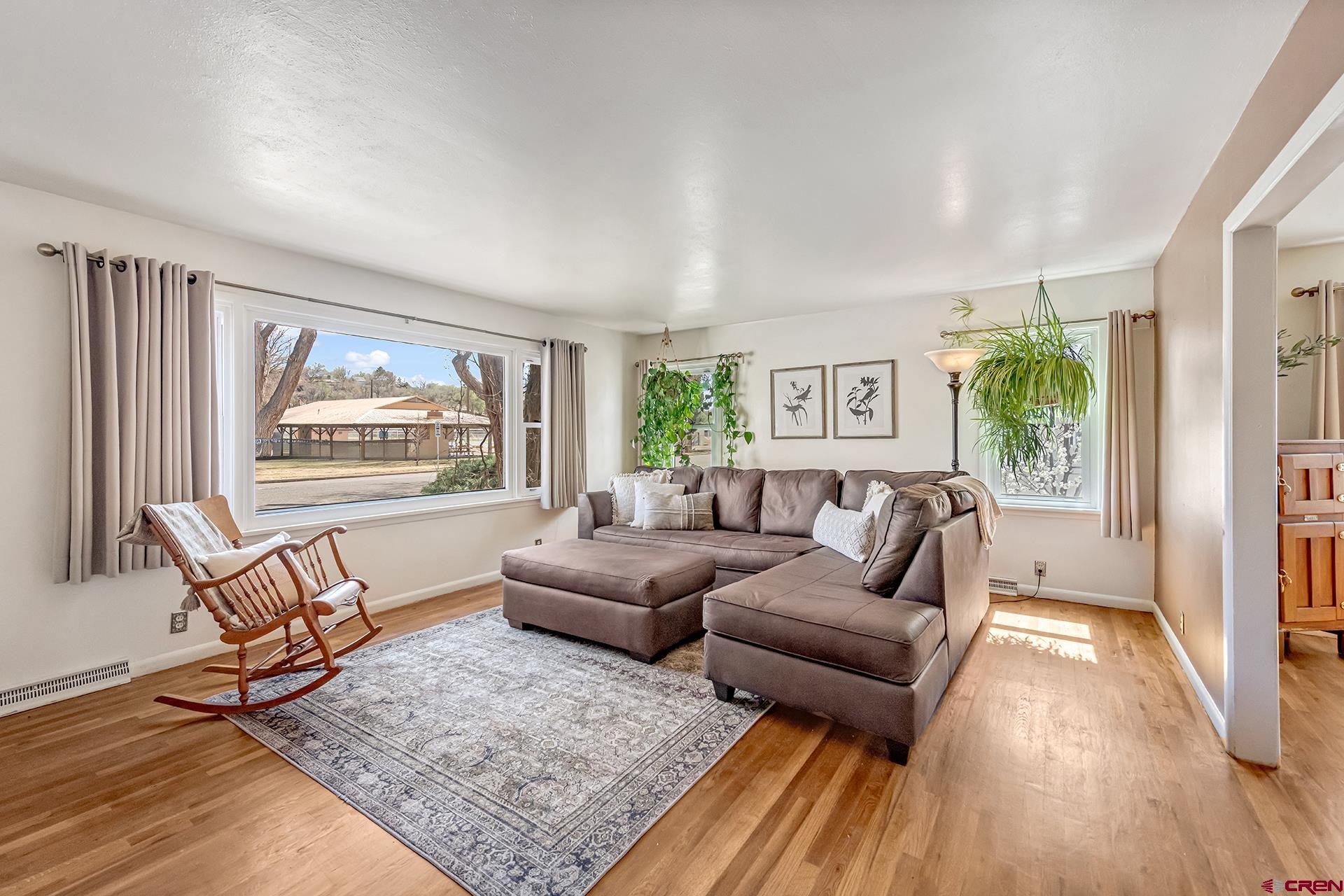 735 Howard Street Delta, CO 81416 - Photo 8 of 34 a living room with furniture and a wooden floor