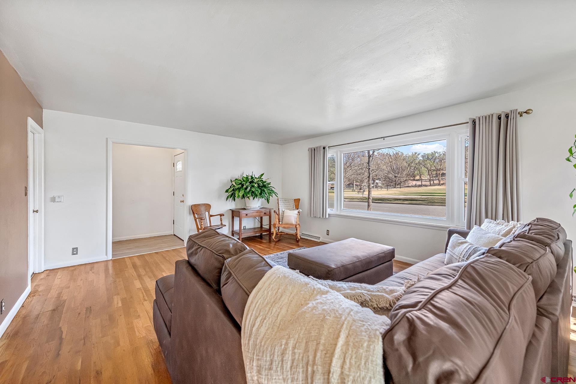 735 Howard Street Delta, CO 81416 - Photo 10 of 34 a bed room with two beds and a potted plant