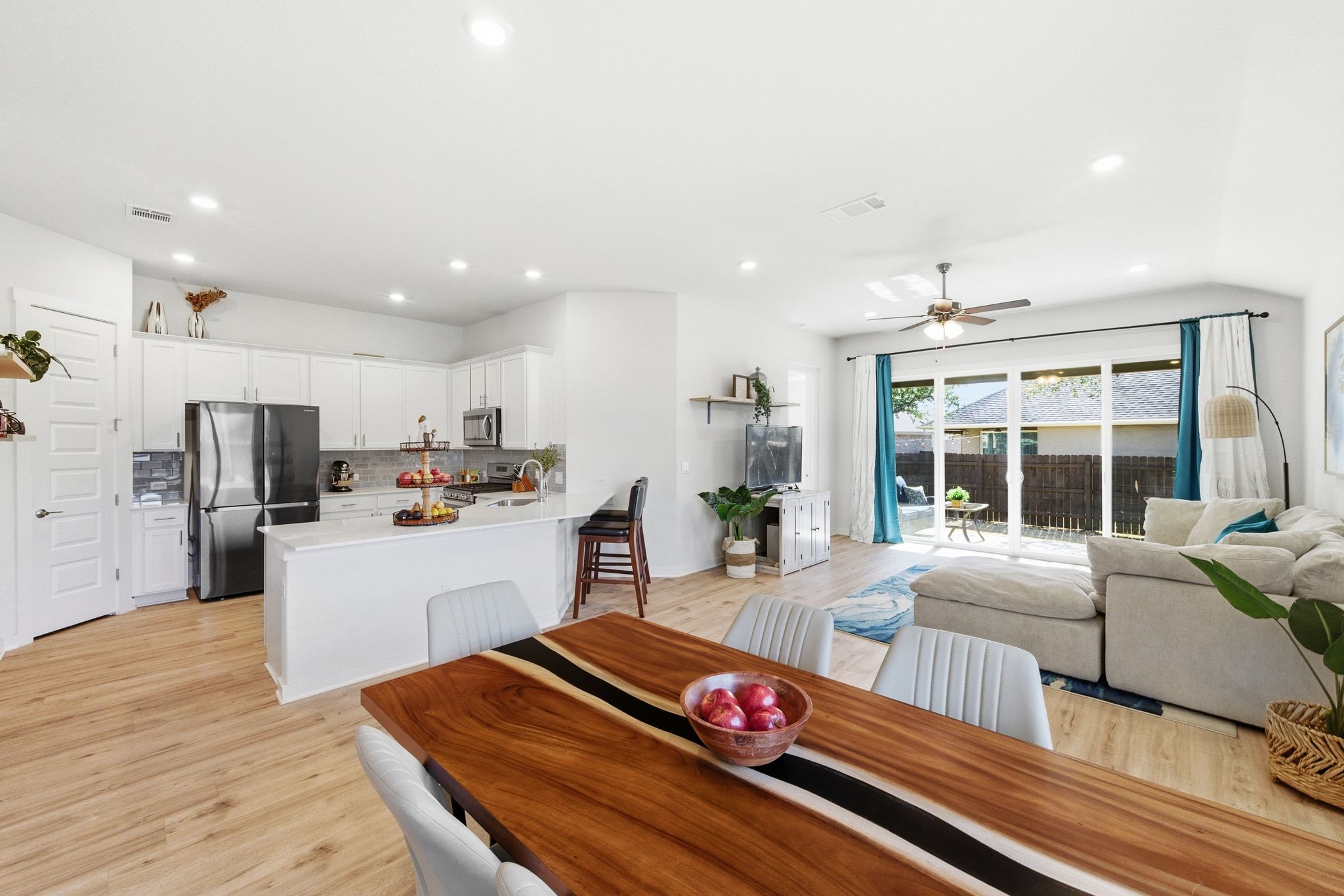 a bedroom with furniture and a large window
