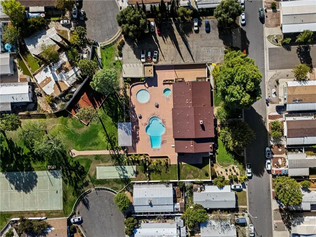 an aerial view of multiple houses with yard