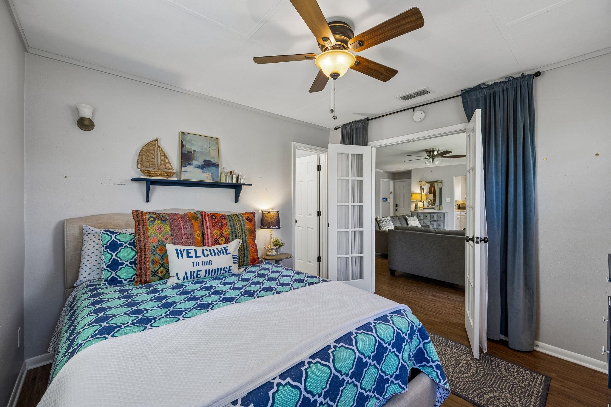 146 Antelope Lane Seguin, TX 78155 - Photo 18 of 28 a bedroom with a bed and a chandelier