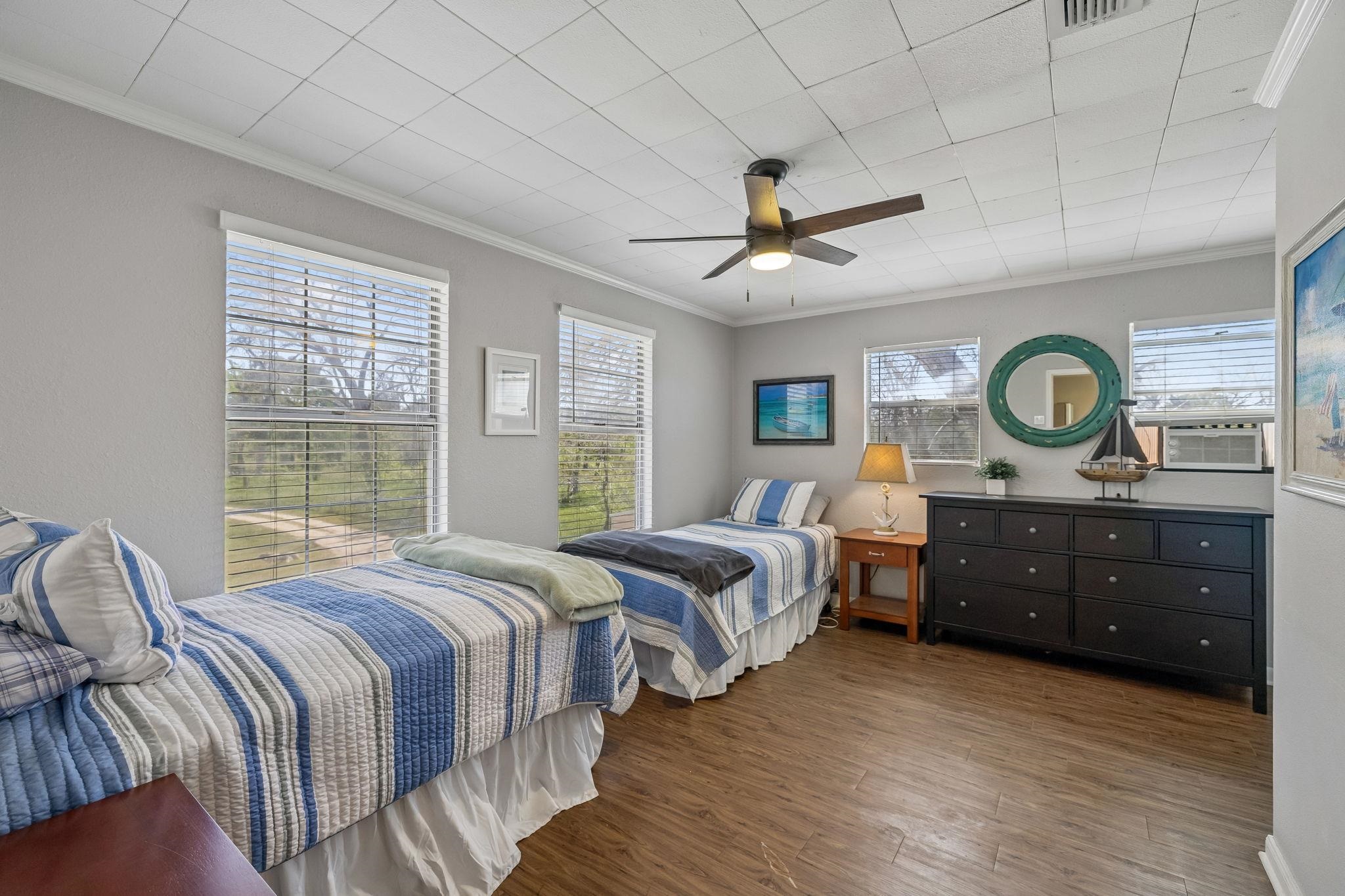 146 Antelope Lane Seguin, TX 78155 - Photo 19 of 28 a bedroom with two beds and a large window