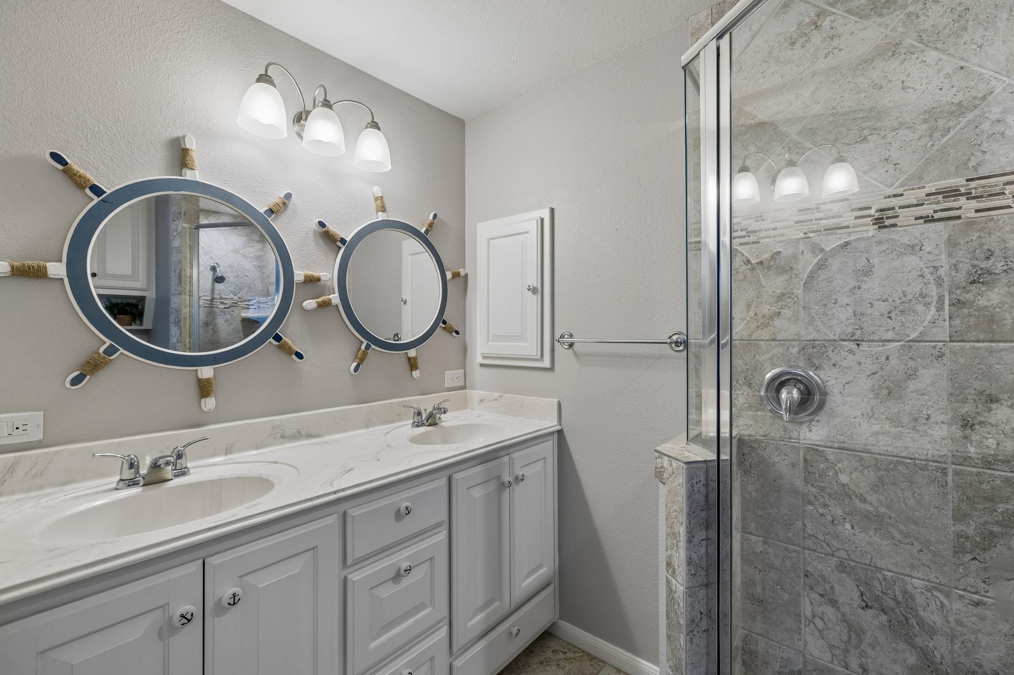 146 Antelope Lane Seguin, TX 78155 - Photo 20 of 28 a bathroom with a double vanity sink and a mirror