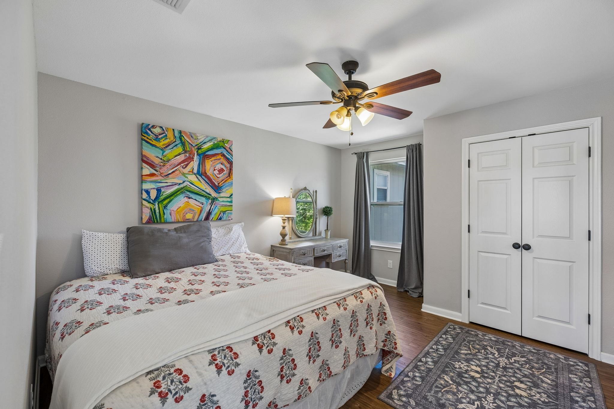 146 Antelope Lane Seguin, TX 78155 - Photo 21 of 28 a bedroom with a bed and a chandelier