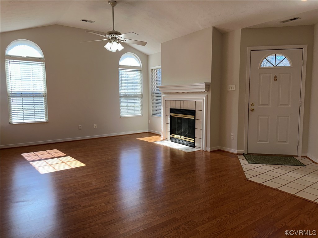 1419 Tannery Circle Midlothian, VA 23113 - Photo 10 of 43 an empty room with wooden floor fireplace and windows