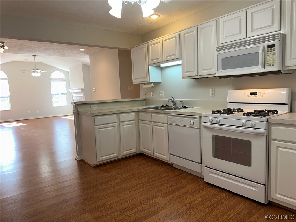 1419 Tannery Circle Midlothian, VA 23113 - Photo 14 of 43 a kitchen with stainless steel appliances granite countertop a sink a stove a microwave and cabinets