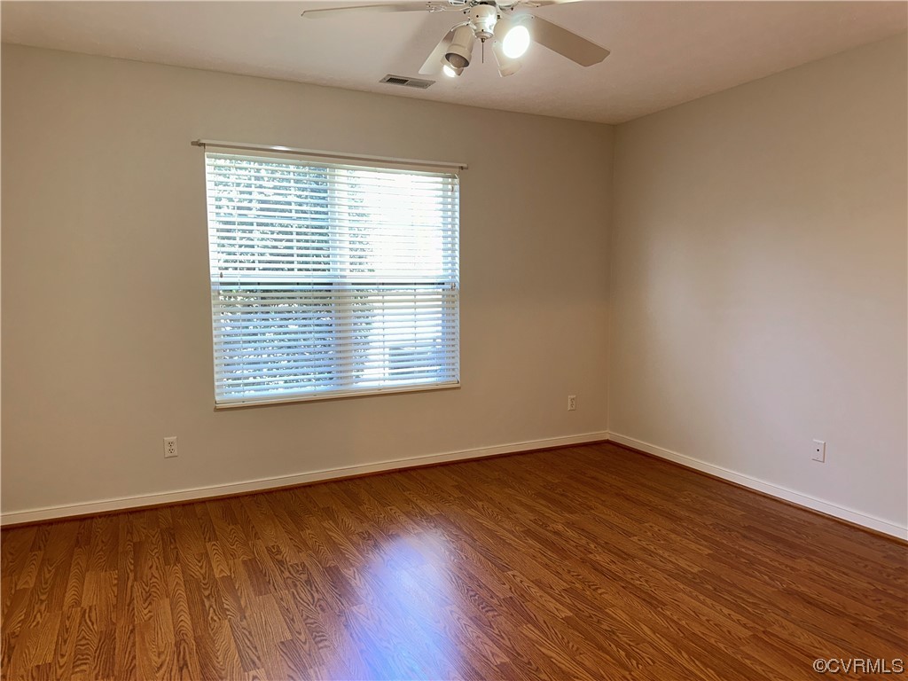 1419 Tannery Circle Midlothian, VA 23113 - Photo 21 of 43 an empty room with wooden floor and windows