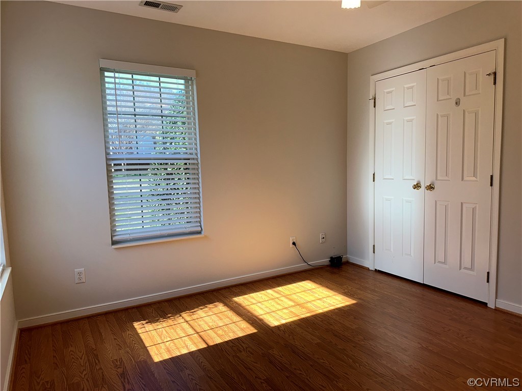 1419 Tannery Circle Midlothian, VA 23113 - Photo 27 of 43 an empty room with wooden floor and windows