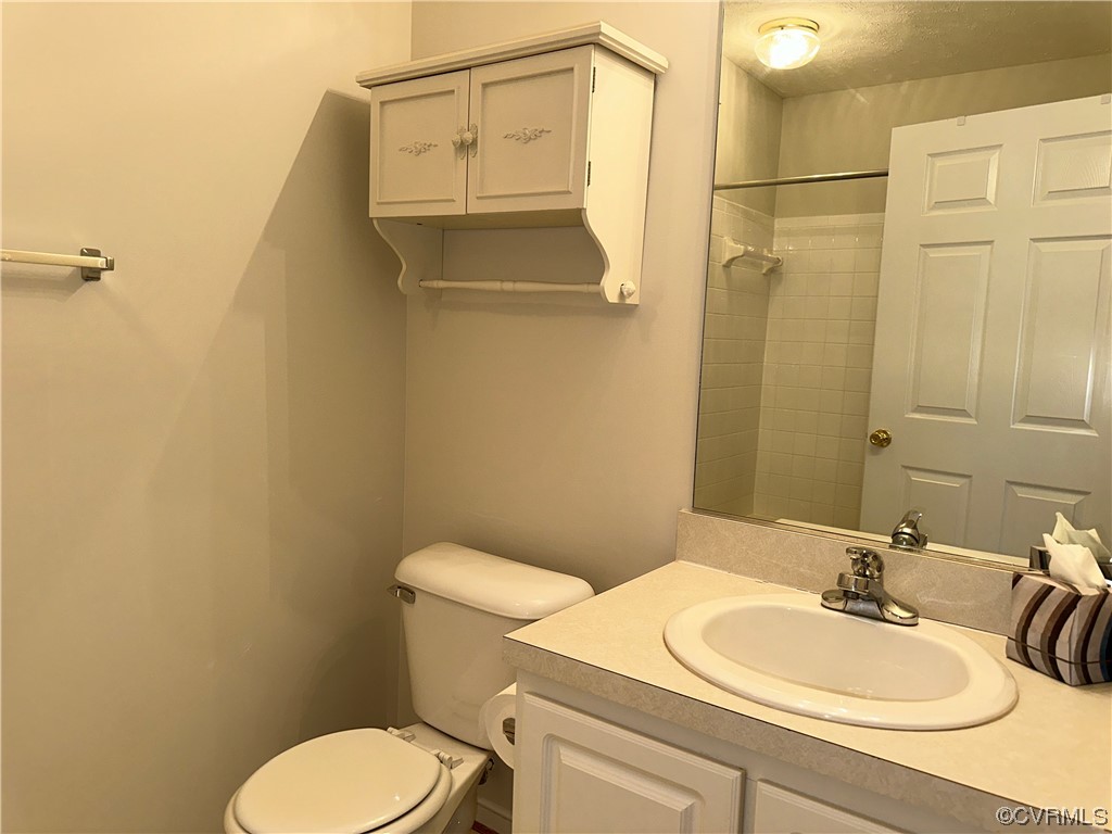 1419 Tannery Circle Midlothian, VA 23113 - Photo 28 of 43 a bathroom with a sink a toilet and shower