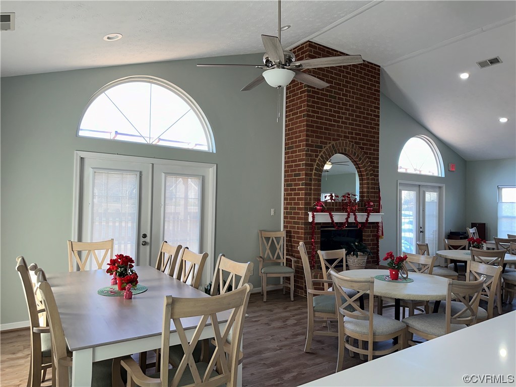 1419 Tannery Circle Midlothian, VA 23113 - Photo 38 of 43 a dining room with wooden floor a chandelier a wooden table and chairs