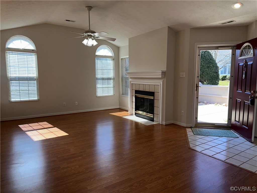 1419 Tannery Circle Midlothian, VA 23113 - Photo 42 of 43 a view of a livingroom with wooden floor a fireplace and windows