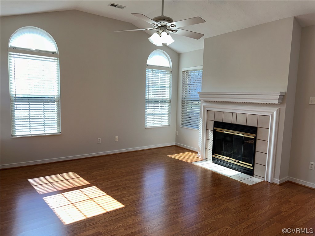 1419 Tannery Circle Midlothian, VA 23113 - Photo 8 of 43 a view of an empty room with wooden floor fireplace and a window