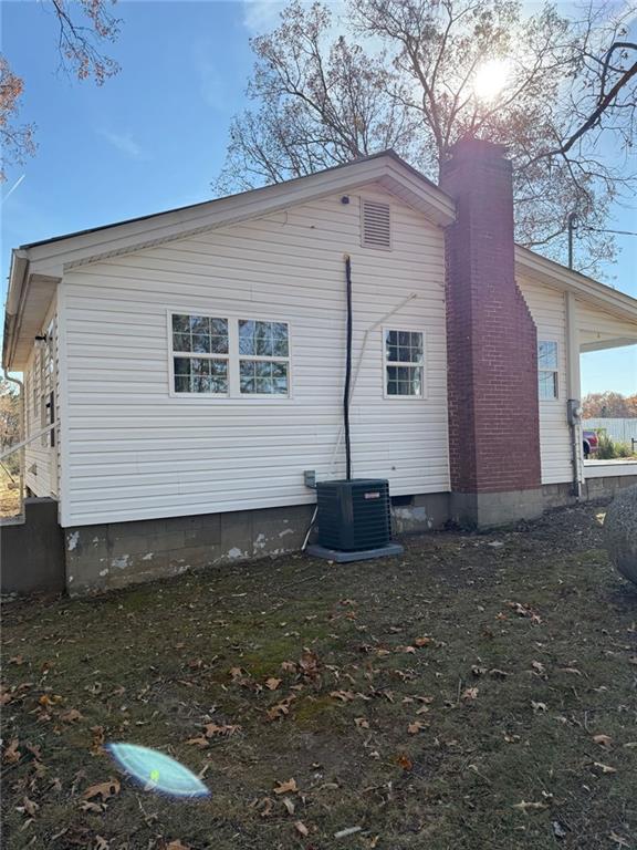 343 Chastain Mill Road Dawsonville, GA 30534 - Photo 11 of 12 a house view with a backyard space