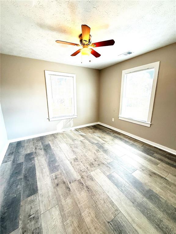 343 Chastain Mill Road Dawsonville, GA 30534 - Photo 8 of 12 a view of empty room with window